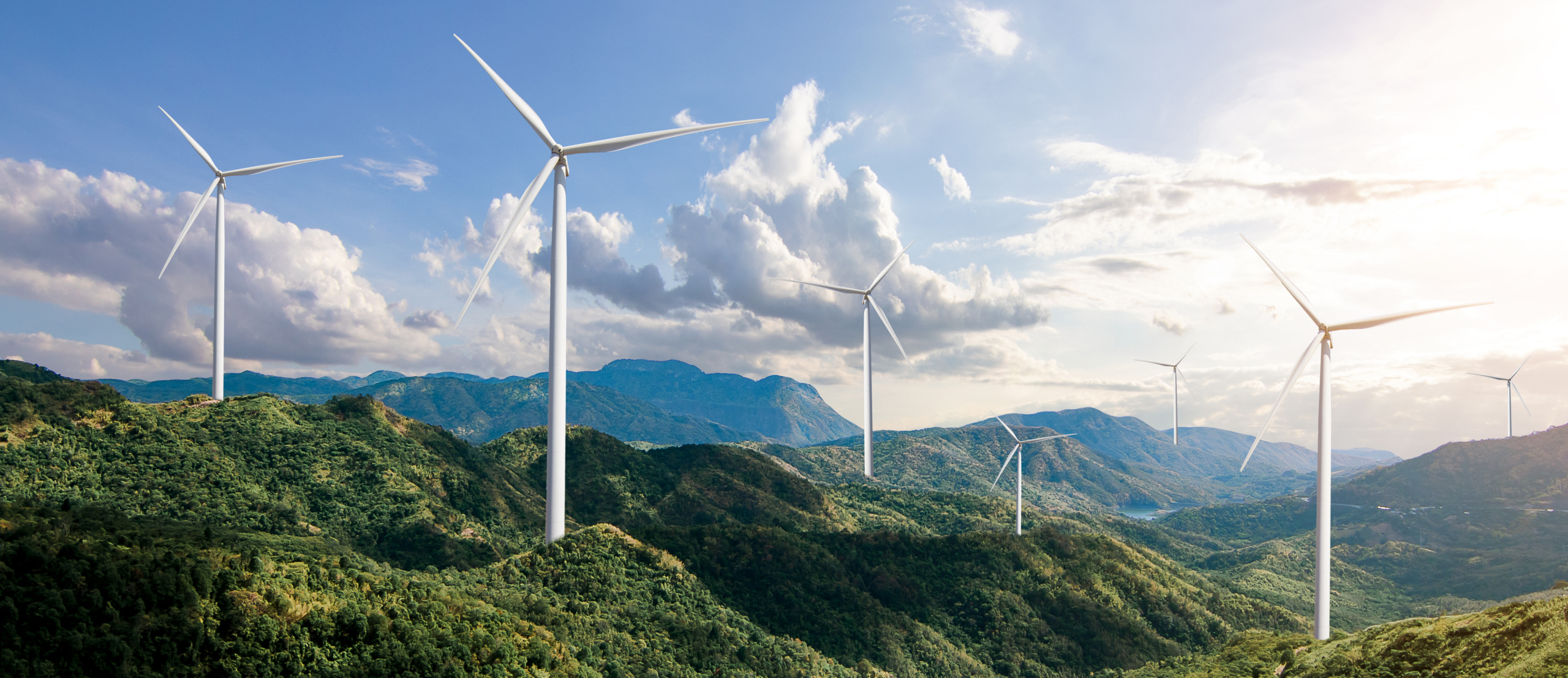 Beautiful,Green,Meadow,With,Wind,Turbines,Generating,Electricity