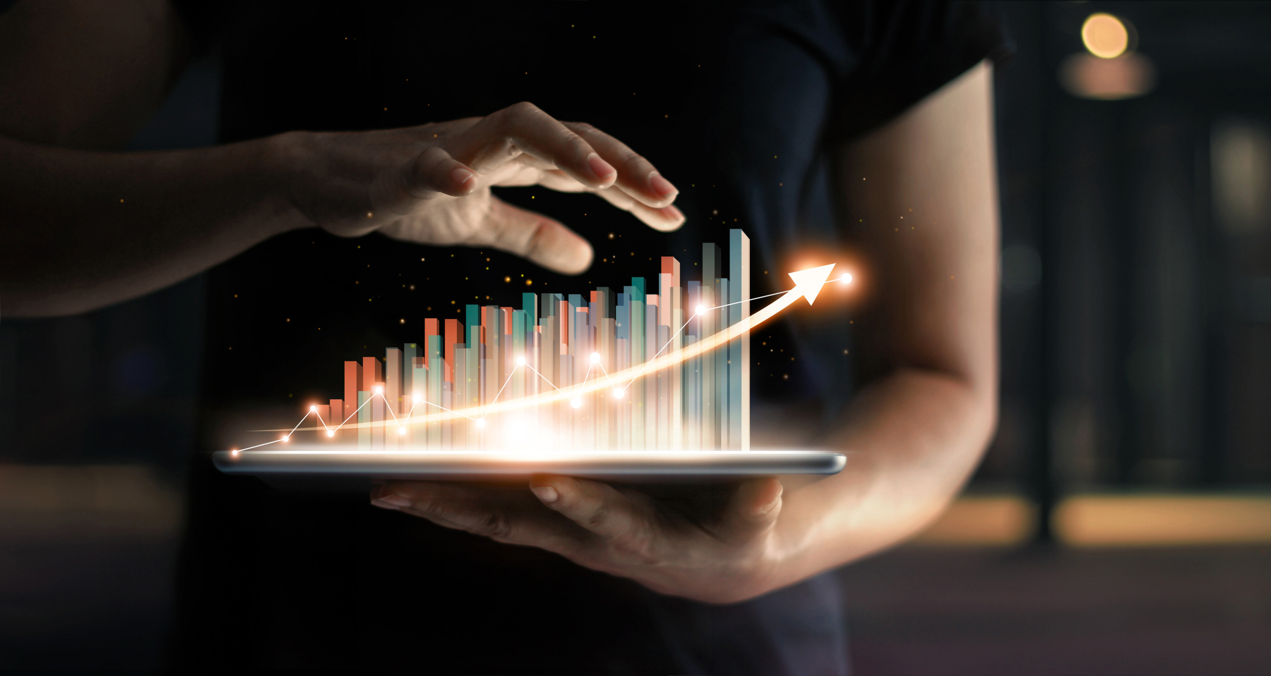 Businessman,Holding,Tablet,And,Showing,A,Growing,Virtual,Hologram,Of